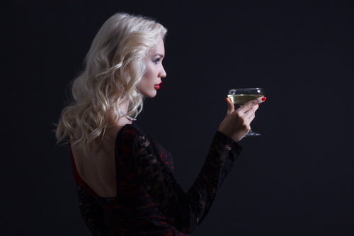 Woman holding a glass of champagne Stock Photo 02