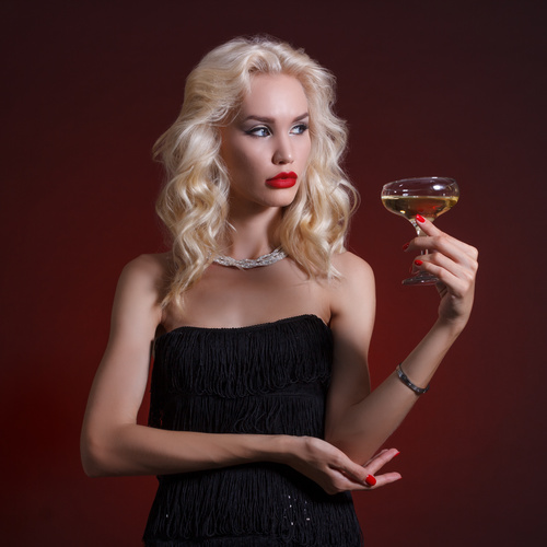 Woman holding a glass of champagne Stock Photo 03