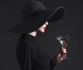 Woman holding a glass of champagne Stock Photo 04