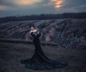 Woman in black dress with headdress posing Stock Photo 02