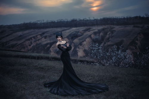 Woman in black dress with headdress posing Stock Photo 02