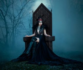 Woman in black dress with headdress posing Stock Photo 04