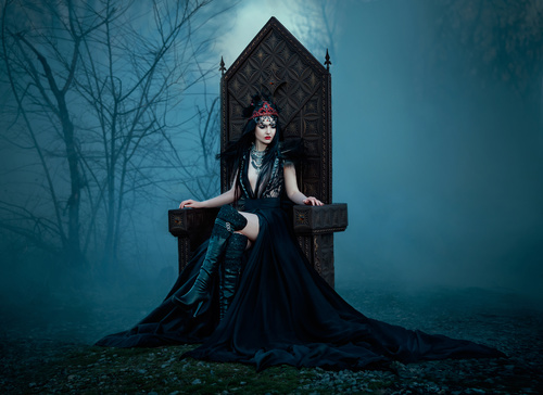 Woman in black dress with headdress posing Stock Photo 04