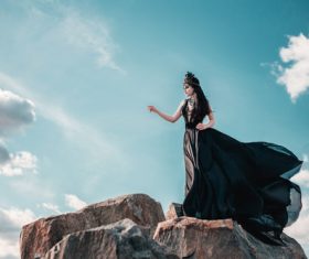Woman in black dress with headdress posing Stock Photo 06