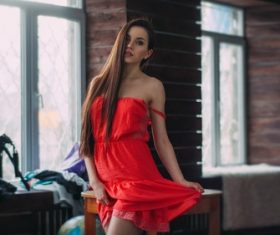 Woman in red dress posing Stock Photo