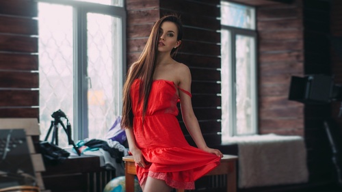 Woman in red dress posing Stock Photo