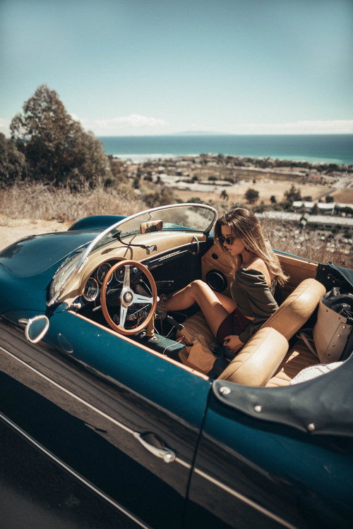 Woman sitting in a convertible car Stock Photo