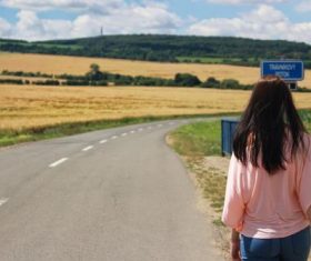 Woman walking on the highway Stock Photo