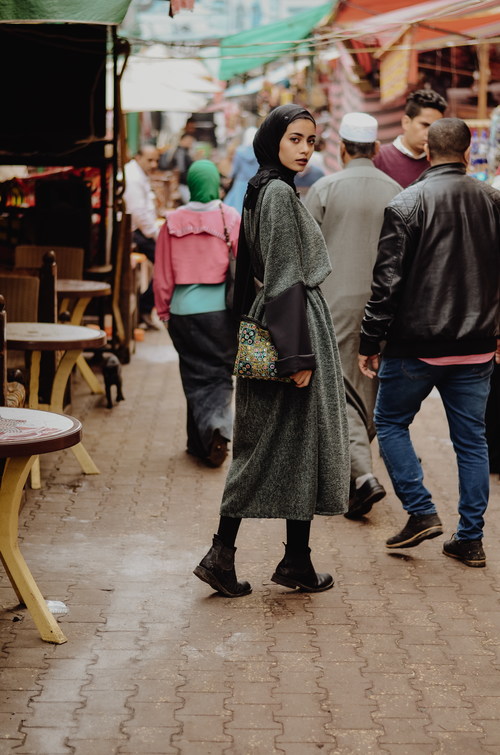 Woman wearing a headscarf turned and looked Stock Photo