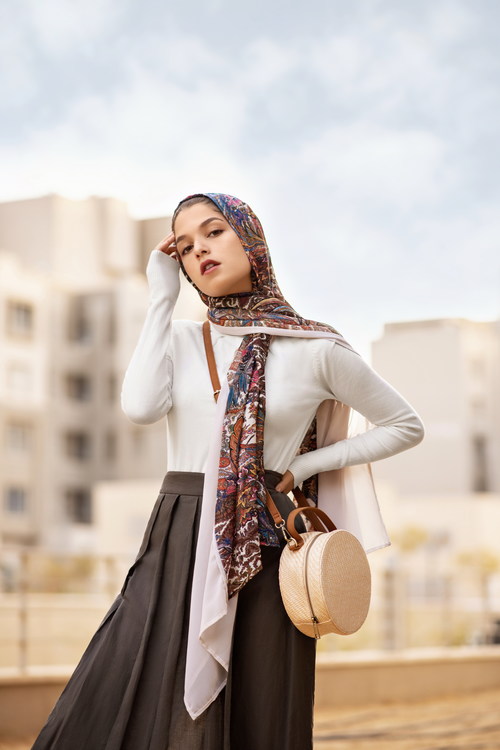 Woman wearing flower headscarf posing Stock Photo