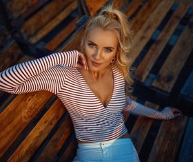 Woman wearing striped T-shirtw outdoors Stock Photo