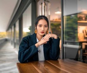 Women model asian sitting at the wooden table Stock Photo