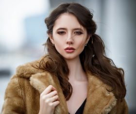 Young beautiful woman wearing mink coat Stock Photo