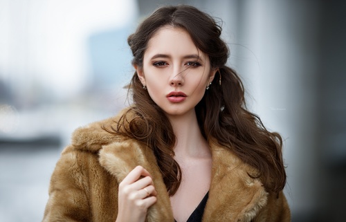 Young beautiful woman wearing mink coat Stock Photo