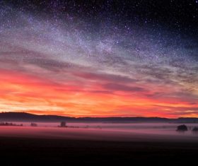 sunset starry night mist Stock Photo