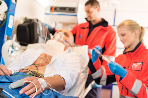 Ambulance personnel and seriously ill patients Stock Photo