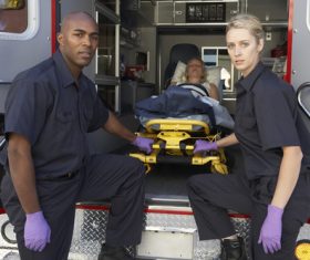 Ambulance staff and patients Stock Photo