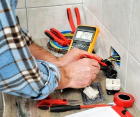 Electrician technician checks the line switch Stock Photo 01