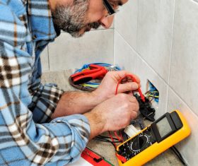 Electrician technician checks the line switch Stock Photo 02