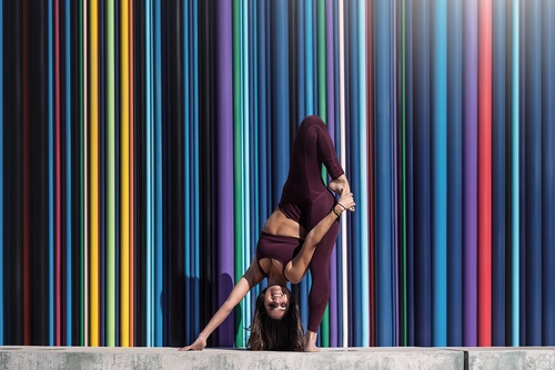 Flexible female handstand Stock Photo