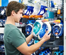 Man buys sporting goods Stock Photo