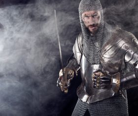Medieval knight wearing armor Stock Photo 04