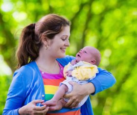 Mother holding baby Stock Photo