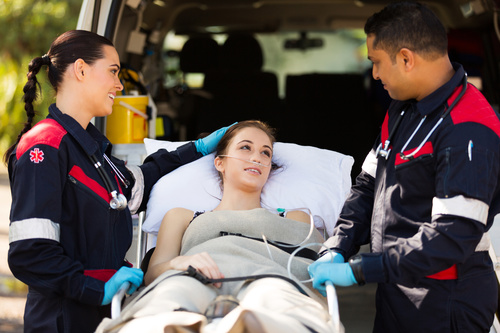 Paramedics rescuers comforting patients Stock Photo