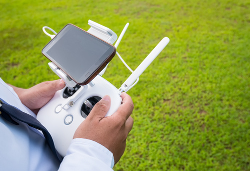 Person holding Quadrocopter wireless controller Stock Photo