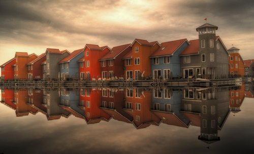 Sea houses reflected in sea Stock Photo
