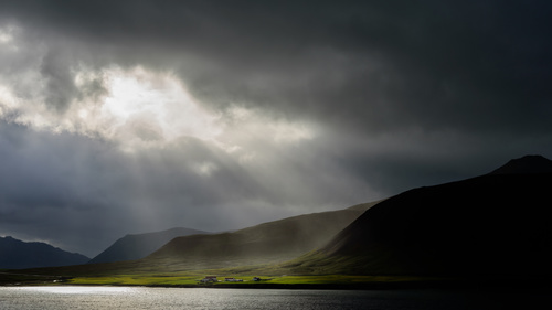 Sunlight through the dark clouds natural scenery Stock Photo