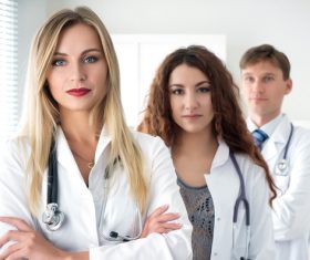 Three doctors taking a group photo Stock Photo