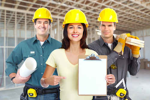 Three house renovation workers Stock Photo