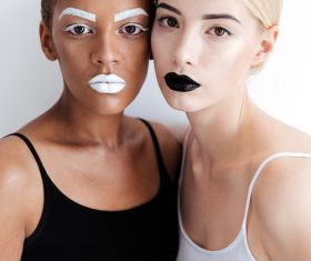 Two black and white makeup women Stock Photo