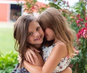 Two hugging little girls Stock Photo