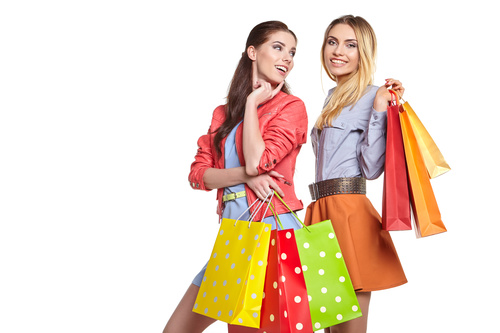 Two women holding shopping bags Stock Photo