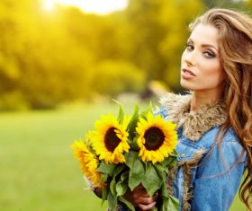 Woman holding sunflower flower Stock Photo