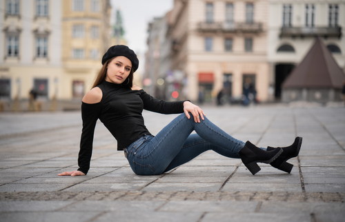 Woman sitting in the square posing Stock Photo