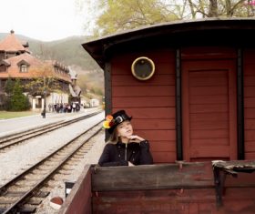 Woman standing on vintage train Stock Photo