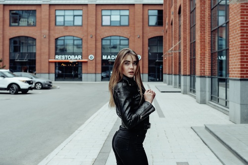 Woman standing outdoors wearing leather jackets Stock Photo