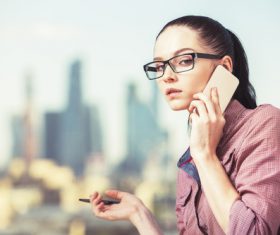 Woman with glasses taking a call Stock Photo 02