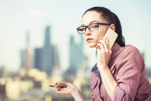 Woman with glasses taking a call Stock Photo 02