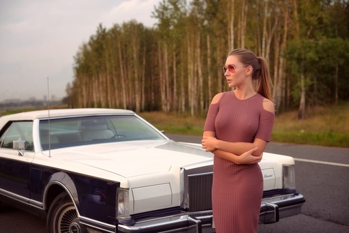 Women wear tight dress and Cadillac car Stock Photo