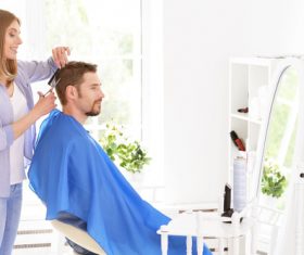 woman and man having a haircut Stock Photo 01
