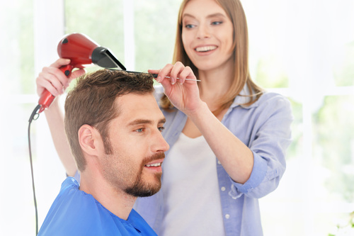 woman and man having a haircut Stock Photo 03