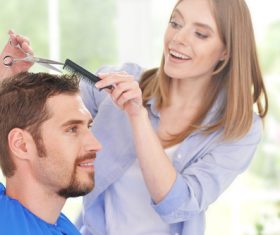 woman and man having a haircut Stock Photo 05