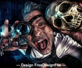 Old medieval scientist with skull and Halloween Stock Photo 01